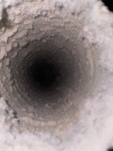 Dryer vent packed solid with lint before cleaning at a west Houston home