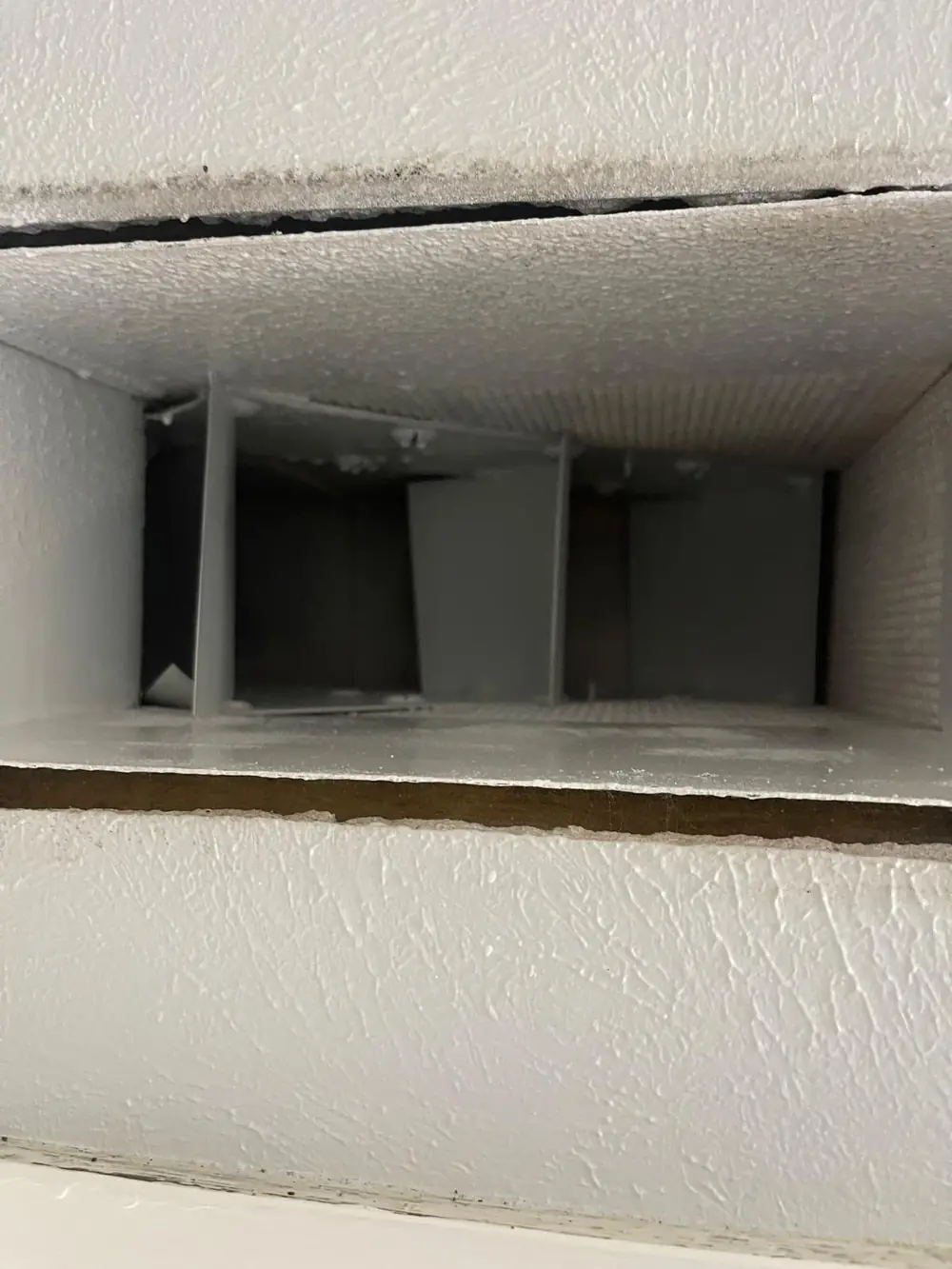 Fiberglass duct board interior sealed with white Foster 40-20 antimicrobial coating after cleaning in Katy TX
