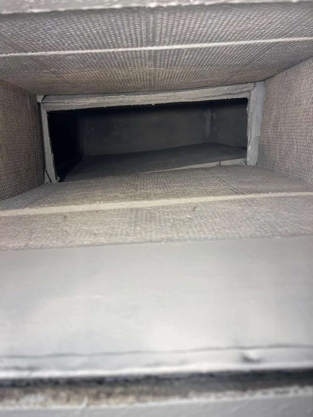 Duct board air duct interior after cleaning and antimicrobial coating by United Air Duct Cleaning Katy TX
