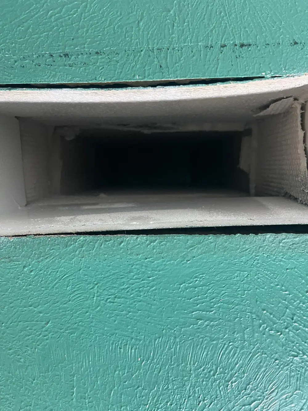 Long duct board trunk line coated with Foster 40-20 fungicidal protective coating in Katy TX home