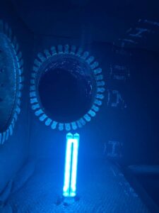UV light glowing inside the cleaned plenum of a Kelliwood Greens home in Katy